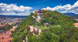 Aerial view on Castle hill (Schloßberg) with famous clock tower (Uhrturm) at Graz in Styria, Austria
