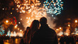 © syhin_stas - man and woman standing with back to camera, looking at bright new year fireworks, enjoying winter night celebration and festive outdoor atmosphere