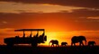 © Saif - Experience wild Africa with majestic elephants and safari jeep at golden sunset