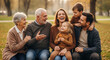 © Ksenia Pestereva - Happy family portrait with mom, dad, grandparents, son and daughter in park setting. Happy family portrait showing connection between generations, joyful expressions, and relaxed posture.