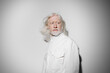 © SHOTPRIME STUDIO - elderly man with long white hair in a white coat against a neutral background, conveying wisdom, experience, and serenity, ideal for concepts of age, beauty, and fashion