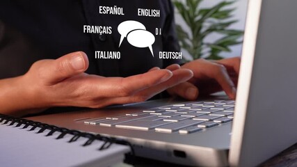 Translation in conversations. A person working in front of a computer while holding an animation of two speech bubbles and several different languages ​​around them.
