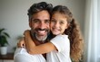 © li - Lovely father and daughter hugging and smiling at the camera. High quality