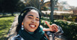 © ChasingMagic25/peopleimages.com - Headphones, peace sign and selfie with girl student on campus for development or education. Emoji, music and portrait of happy teen outdoor at college or university for social media profile picture