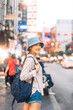 Asian woman traveler backpack solo travel in city chinatown street food market taste of Bangkok, Thailand