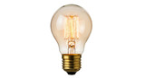 Isolated Edison light bulb emits warm, gentle light due to the incandescent filament design