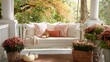 © fotofabrika - Cozy porch swing decorated with autumn flowers and cushions in a serene garden setting during fall