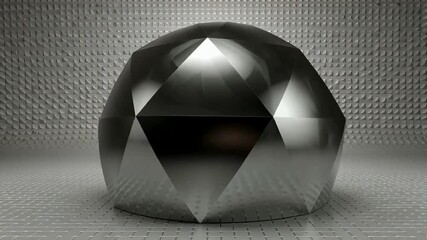polished metallic sphere with faceted geometric pattern reflecting light on textured surface