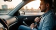 © Margarita Ratatosk - Man fastening seatbelt in car dashboard. Road safety concept with driver using safety belt for accident prevention and secure travel.