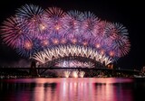 Spectacular fireworks display illuminates sydney harbour bridge at night