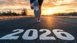© Henry - Person running on road with 2026 painted on surface during golden hour light