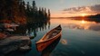 © SaroStock - Canoe at waters edge during beautiful golden sunrise over calm lake in algonquin provincial park