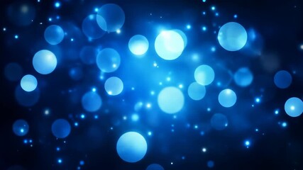 Abstract blue bokeh light background with sparkling particles effect.