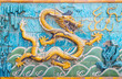 close up on ancient nine dragon screen wall built 600 years ago in forbidden city