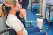 © Cynthia - woman in wheelchair with oxygen nebuliser mask being applied by nurse, gp general practice medical healthcare clinic, asthma COPD treatment