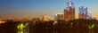 Evening city landscape. Wide panorama of the city. View of multi-storey buildings with evening illumination. City of Yekaterinburg, Sverdlovsk region, Russia