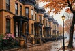© Natalia - charming brick townhouses lined along a rainy street in autumn