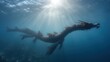 © A4719 - Underwater photo of a dark, dragon like sculpture in deep blue water, sun rays breaking through the surface.