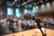 © Ima - Microphone stands ready for a speaker at conference, ready to share insight