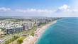 Aerial drone view of Antalya cityscape and Konyaalti beach, people sunbathing on sand, swimming in sea and relaxing, Antalya holiday vacation resort in Turkey