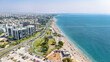 Aerial drone view of Antalya cityscape and Konyaalti beach, people sunbathing on sand, swimming in sea and relaxing, Antalya holiday vacation resort in Turkey