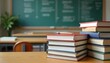 © Vadym - Textbooks stacked on desk classroom. Books, pen, blurred background of chalkboard, desks. Education, school theme, learning, teaching, study concept, knowledge. Reading materials, student resources,