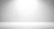 © ArturaStock - Clean empty white studio room with spotlight creating smooth gradient background, perfect for product photography, presentations, or advertising display.