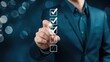 © Prosenjit - Checklist of Success: A hand in a suit points to a checklist, with each box marked, against a backdrop of blurred lights. Suggesting focus and planning