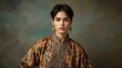 © TopImage - Fashion model wearing embroidered ethnic jacket showcasing traditional style, perfect for cultural events, fashion magazines, portrait photography with warm muted background and artistic mood