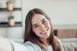 © Daniel - Young happy and cheerful woman taking a selfie smiling looking at the camera, enjoying free time at home working and studying indoor in office