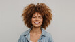 © Oldboy - Portrait of smiling woman with red afro hairstyle in denim jacket against gray background