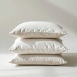 © Pure Imagination - Neutral Beige Pillows Stacked in Soft Light with Textured Fabrics Interior Design