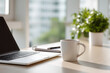 © rungnapha - Minimalist desk setup with laptop, notebook, and coffee mug creates serene workspace