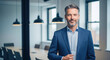 © InfinityVisuals - Confident Leader in Modern Office: A distinguished business professional exudes confidence, standing in a contemporary office space with sleek lines, embodying leadership, poise.
