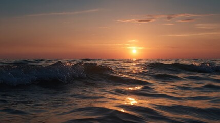 Wall Mural - Soft waves gently lap against each other as the sun sets on the horizon, casting a golden glow over the tranquil ocean.