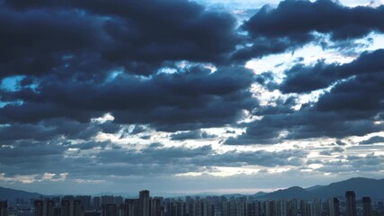 Wall Mural - Dark stormy clouds over the city