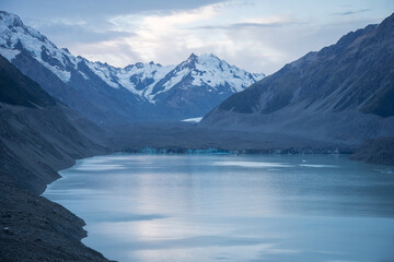  Glacier landscape scenery with snowy mountain, glacier and glacial lake at front, New Zealand
