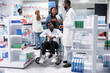 © DC Studio - African American medical staff advising a customer with disability about prescription drugs use or medication dosage, pharmaceutical service during a pharmacy retail visit focused on health.