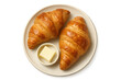 © whitestorm - Two fresh croissants with butter on a plate isolated on transparent background