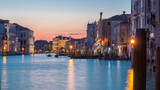 View of the Grand canal near Rialto Market day to night timelapse after sunset, Venice, Italy viewed from pier