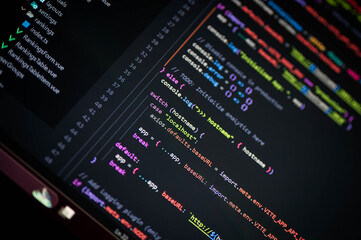 close-up of colorful programming code showing switch case with hostname localhost and axios.defaults