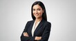 © dals stock - Confident and Smiling Businesswoman with Arms Crossed on Gray Background