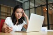 © AMA  - young woman working on laptop