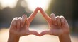 © gufron - Focused Hands Framing a Triangle.