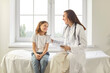 © Studio Romantic - Pediatrician kind smiling doctor talking listening to kid, child health care, clinic checking up exam, kid patient sitting on coach, healthcare hospital professional controlling physical well-being