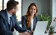 © lei - Happy busy female manager explaining corporate software work talking to young male employee consulting client working on computer using laptop discussing business project plan at office meeting.