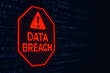 © praewpailyn - Data breach warning sign glows red on digital screen symbolizing cybersecurity breach and system hacked alert in dark environment with sense of urgency
