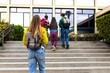 © Daniel - Students walking up stairs at school building entrance