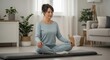 © AlfaSmart - Peaceful meditation practice in cozy home interior with woman in relaxed pose surrounded by plants