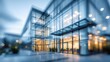 © Luna Whisper - Blurred contemporary commercial office building facade with transparent glass walls showcasing modern workplace activity, corporate business culture innovation concept.